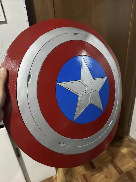 Hand-built Captain America shield prop with painted star and rings finish