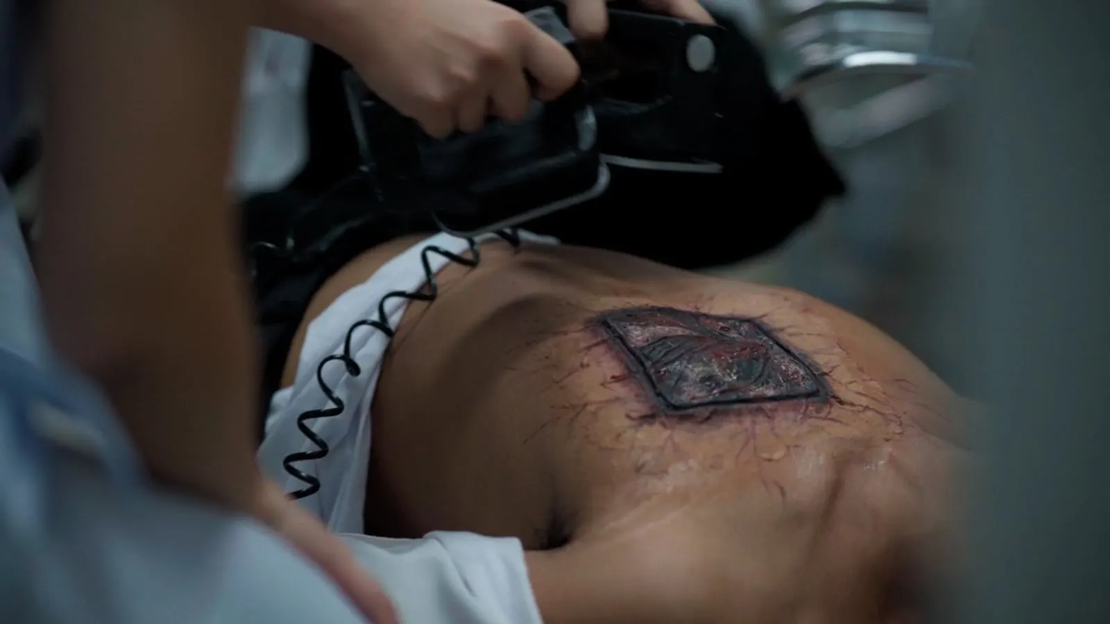 Special-effects prosthetic wound makeup in close-up detail